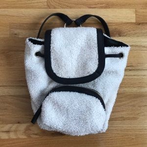 Cute fuzzy black and cream small backpack